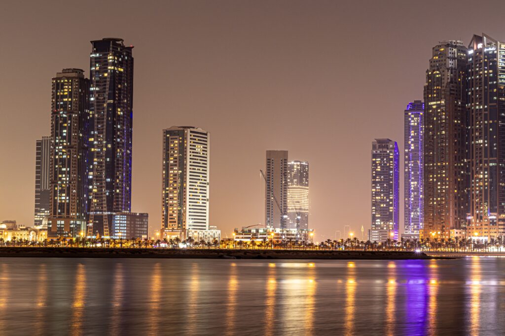 High-rise buildings beside the water in the United Arab Emirates at night